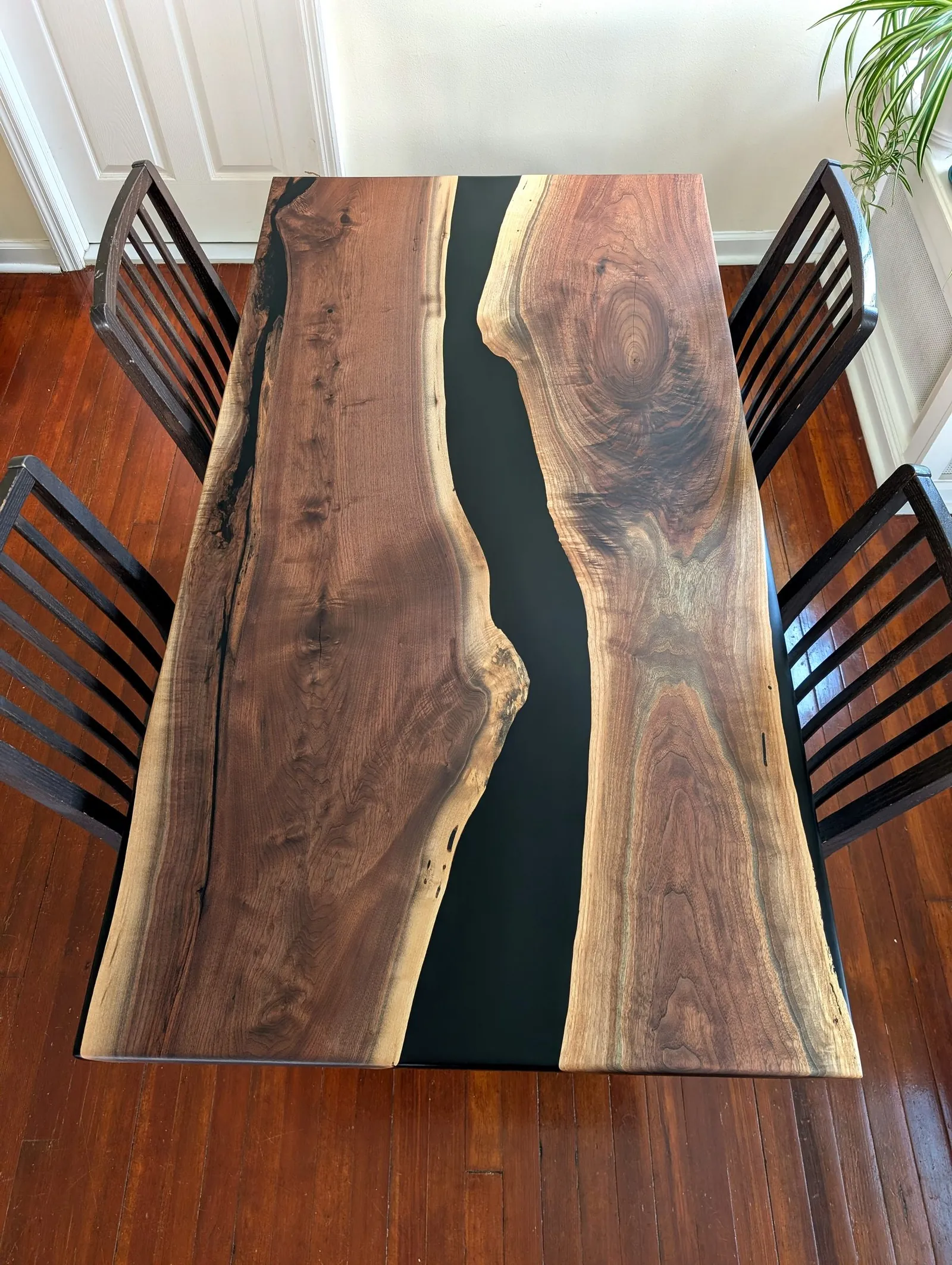 Black walnut river table with black epoxy, live edge, dining room setting